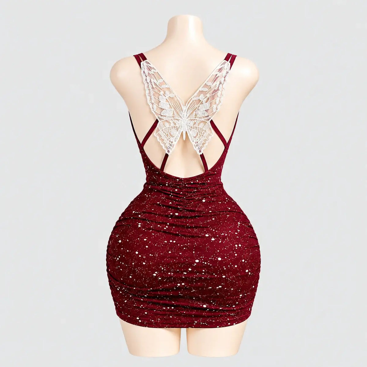 Glitter mini dress with a lace butterfly back
