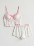 Cute ribbed pajama set with pink bow details.