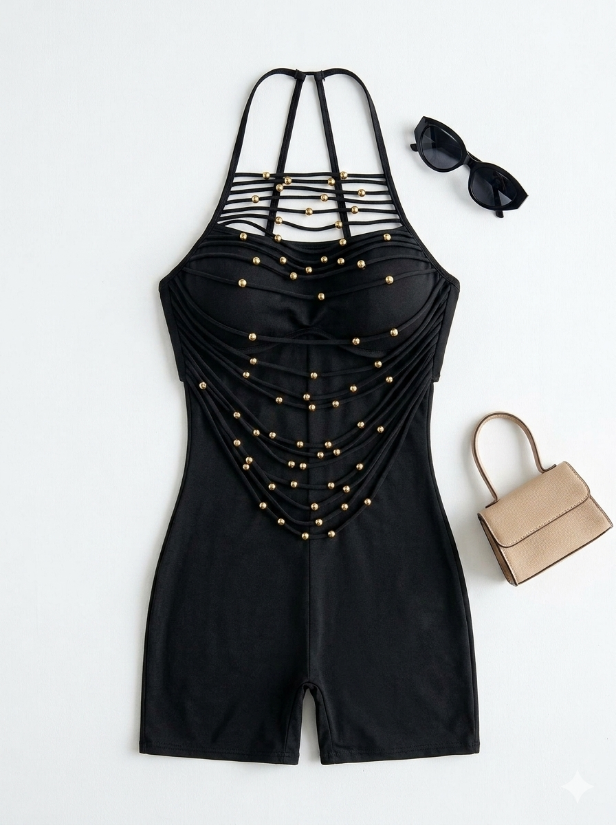 One-piece black strappy bodysuit with gold studs