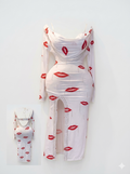Belly dance costume with lip print and side slit.
