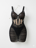 A sheer black mesh mini dress